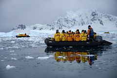 10B Zodiacs In Paradise Harbour With Mountain On Lemaire Island Beyond On Quark Expeditions Antarctica Cruise.jpg
